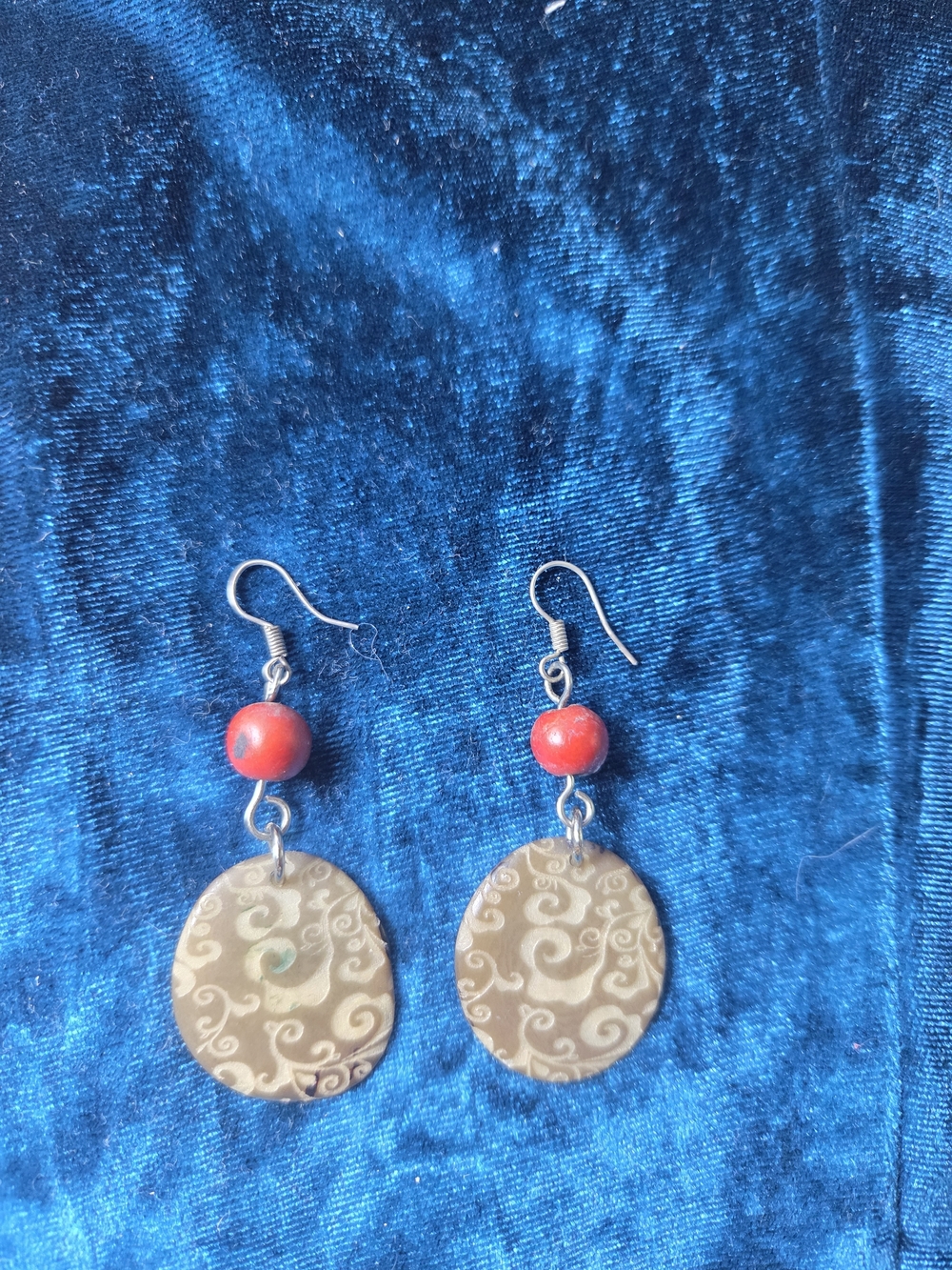 Handcrafted Brown Swirl Disc Earrings with Red Bead